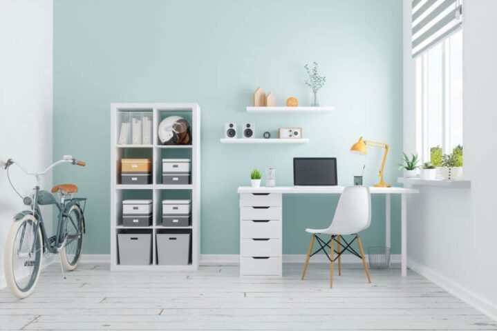 A-white-themed-office-area-with-a-white-working-table-and-cabinet-and-indoor-plants-on-the-side-1-1024x683