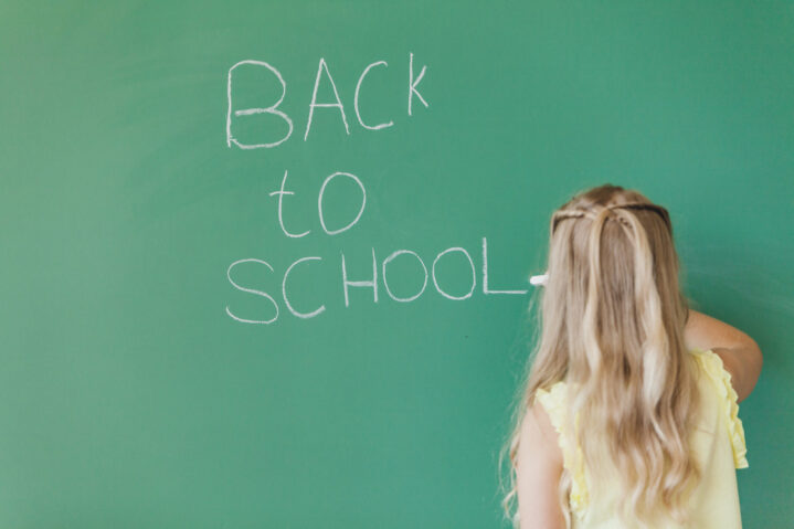 blonde-girl-writing-chalkboard