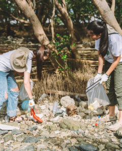 Group of asian diverse people volunteer teamwork ,environment conservation,volunteer help to picking plastic and foam garbage on park area.Volunteering world environment day.