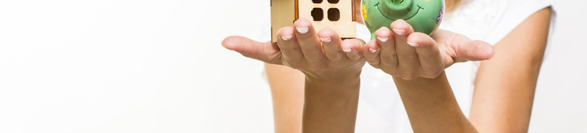 smiley-woman-holding-wooden-cottage-piggy-back