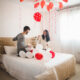 smiling-girl-looking-balloons-roof