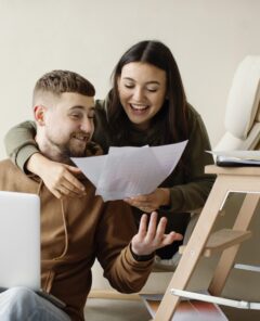 medium-shot-couple-looking-plans